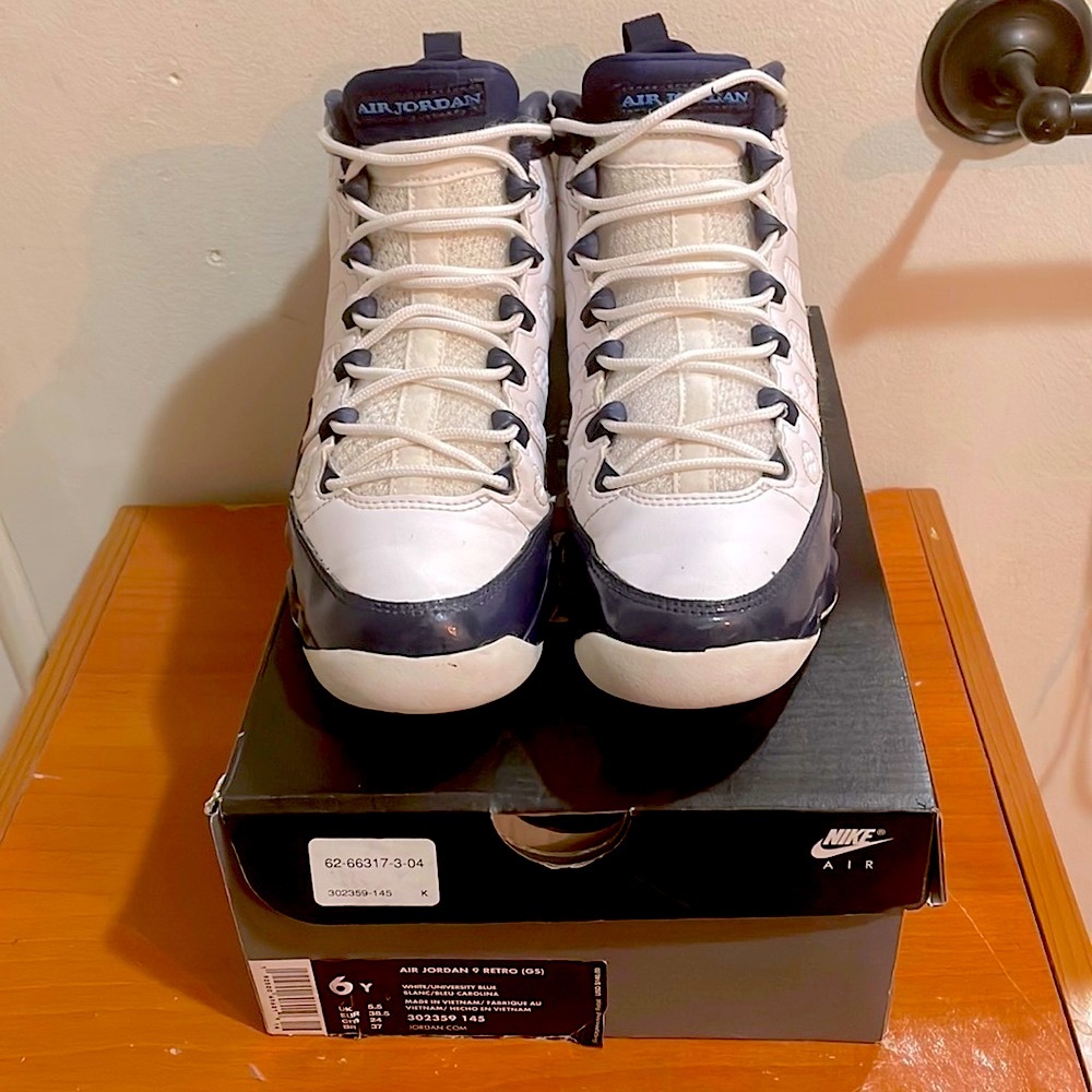 Authentic Retro Air Jordan 9 white upper leather complimented by midnight blue.